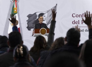 President Sheinbaum looks out over the press pool at her morning conference