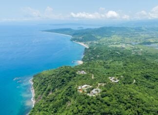 Aerial view of lo de marcos, nayarit, mexico, showcasing the stunning coastline, crystal-clear turquoise waters, sandy beach, and lush green vegetation