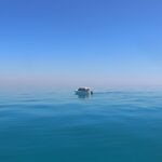 a boat in the middle of the ocean