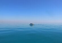 a boat in the middle of the ocean