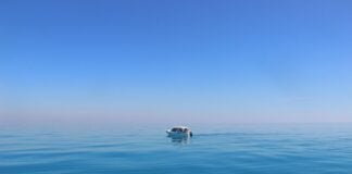 a boat in the middle of the ocean