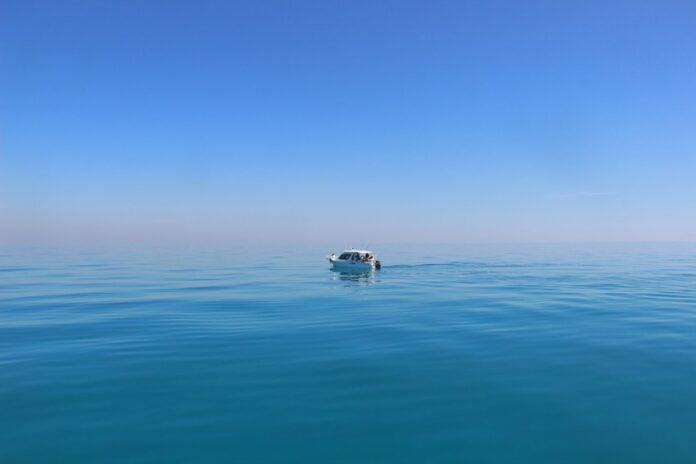 a boat in the middle of the ocean