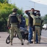 a person being detained by Mexican authorities