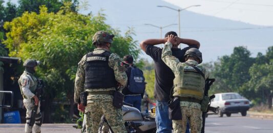 a person being detained by Mexican authorities
