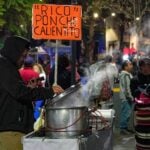 a vendor serving punch in the cold