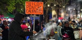 a vendor serving punch in the cold