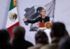 President Sheinbaum gestures from the podium of her morning press conference