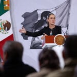 President Sheinbaum gestures from the podium of her morning press conference