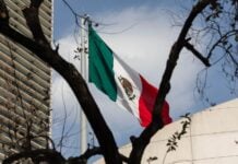 A Mexican flag flies near downtown Mexico City