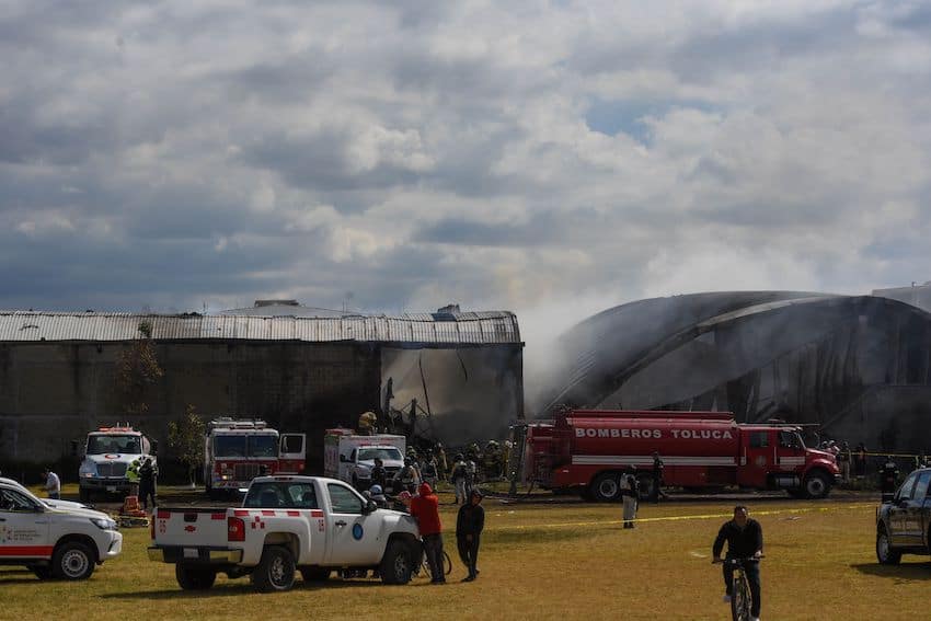Firetrucks work to contain fire from plane crash near Toluca airport
