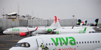 Viva Aerobus planes at the Mexico City airport with Volaris planes visible in the background