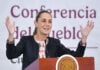 President Sheinbaum gestures from behind the podium of her morning press conference