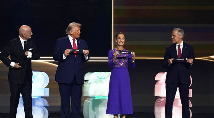 President Sheinbaum on stage next to Trump and Carney, holding a paper reading Mexico