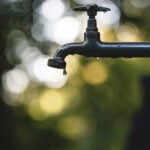 Water drips from an outdoor spigot