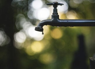 Water drips from an outdoor spigot