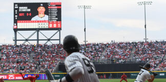 A Yankee batter swings at a baseball thrown by the Mexico City Diablos Rojos pitcher in Alfredo Harp Helú Stadium