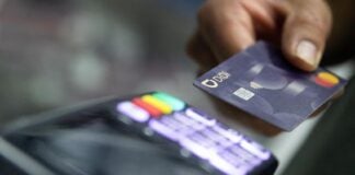 a person using a credit card at a terminal