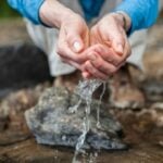Water running through fingers