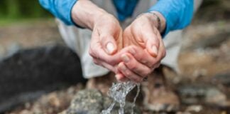 Water running through fingers