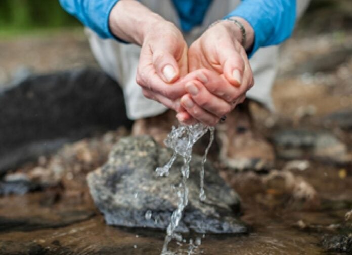 Water running through fingers