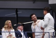 Cadillac driver Sergio Pérez with Tommy Hilfiger and wife Dee Hilfiger at the 2025 U.S. Open.