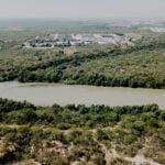 The Nuevo Laredo International Wastewater Treatment Plant in Mexico seen across the Rio Grande from Laredo.