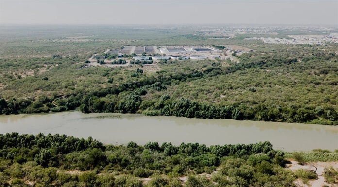 The Nuevo Laredo International Wastewater Treatment Plant in Mexico seen across the Rio Grande from Laredo.
