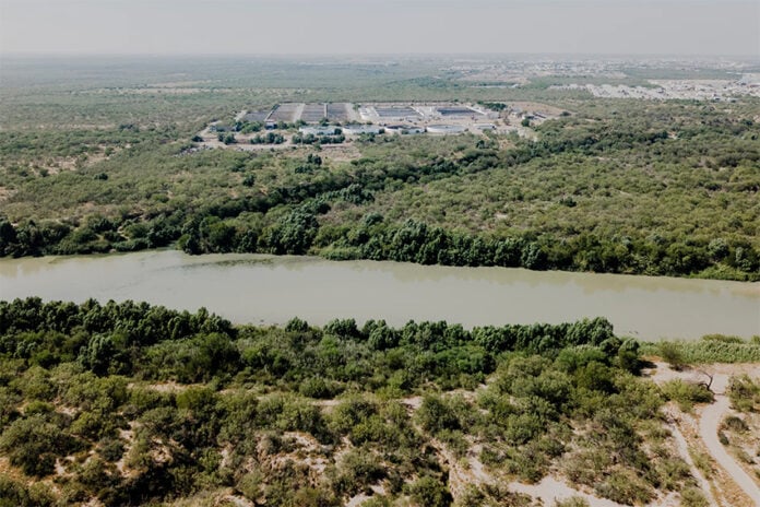 The Nuevo Laredo International Wastewater Treatment Plant in Mexico seen across the Rio Grande from Laredo.