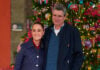President Sheinbaum and her husband in front of a Christmas tree