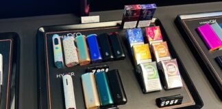Kyiv, Ukraine - February 04, 2025: Selection of vaping devices, flavored pods, and accessories on a store counter display