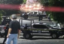 a person observing a crime scenewith cop cars from afar