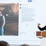 Sheinbaum stands before an image of Ryan Wedding presented at her morning press conference on Jan. 26, 2026