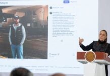 Sheinbaum stands before an image of Ryan Wedding presented at her morning press conference on Jan. 26, 2026