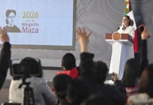 Press raise their hands at President Claudia Sheinbaum's morning conference