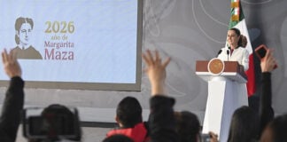 Press raise their hands at President Claudia Sheinbaum's morning conference