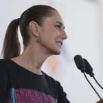 President Sheinbaum speaks into a microphone