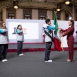 Mexico’s President Claudia Sheinbaum leads the flag-bearing ceremony for the Mexican Olympic delegation following her daily press conference on Monday.