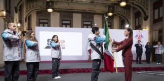 Mexico’s President Claudia Sheinbaum leads the flag-bearing ceremony for the Mexican Olympic delegation following her daily press conference on Monday.