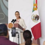 President Claudia Sheinbaum at the podium of her morning press conference