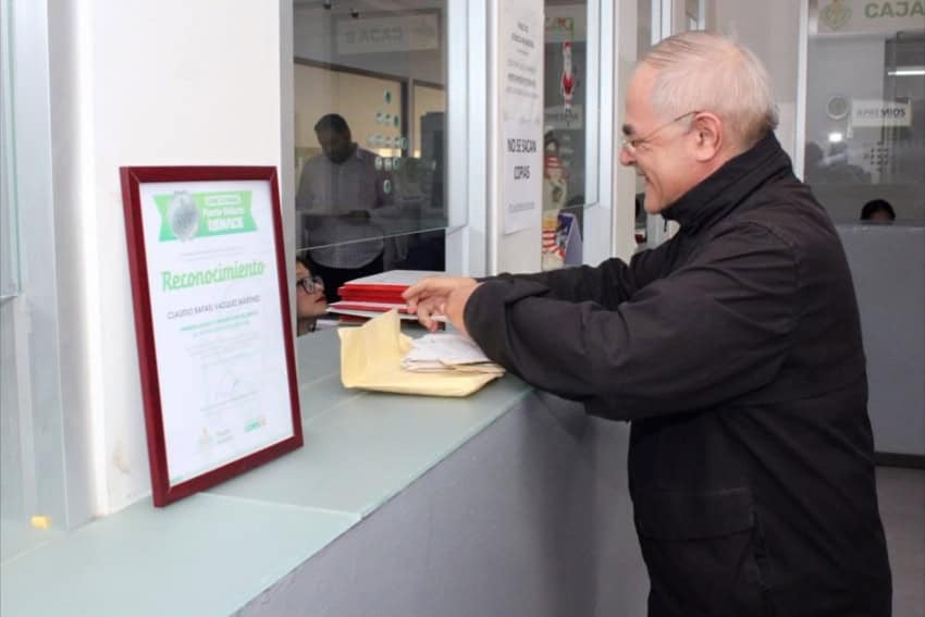 man paying property taxes in Puerto Vallarta