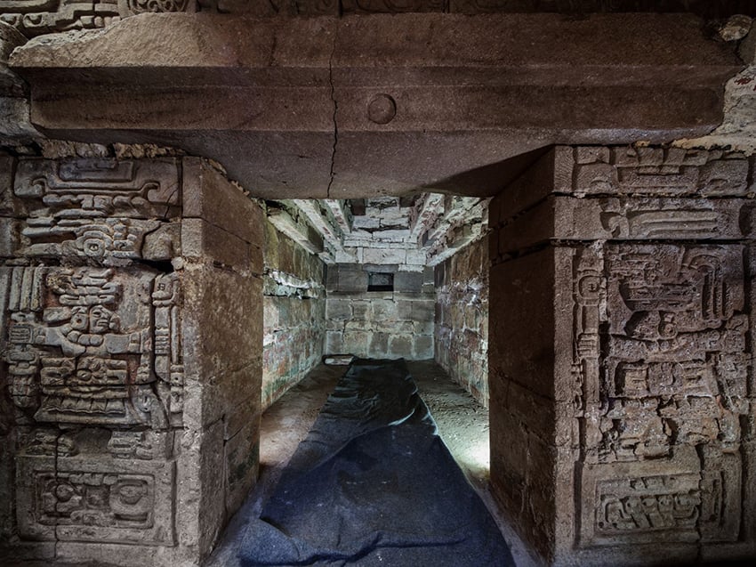 The entrance to an ornate carved stone Zapotec tomb in Hutizo, Oaxaca
