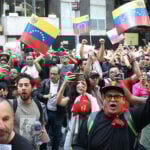 Protesters shout and wave Venezuelan flags in Mexico City