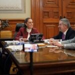 Mexico's president sits at a round table while on a phone call with U.S. President Trump