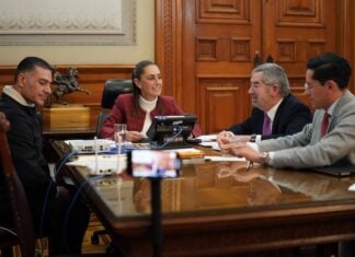 Mexico's president sits at a round table while on a phone call with U.S. President Trump