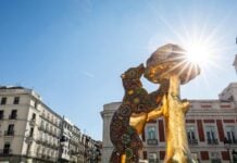 a monumental sculpture of Madrid’s symbol, the Bear and the Madroño, featuring a Huichol design