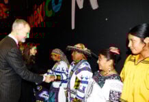 The king of Spain shakes hands with Mexico's tourism delegation at the tourism festival FITUR in Madrid