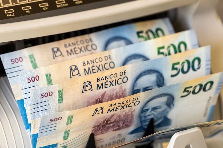 Mexican pesos in cash counting machine. Mexico money. Business concept. peso exchange rate, Financial settlements. closeup