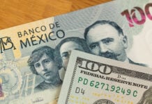A 100 dollar bill and a 100 Mexican peso bill.
