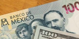 A 100 dollar bill and a 100 Mexican peso bill.