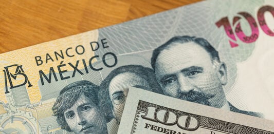 A 100 dollar bill and a 100 Mexican peso bill.